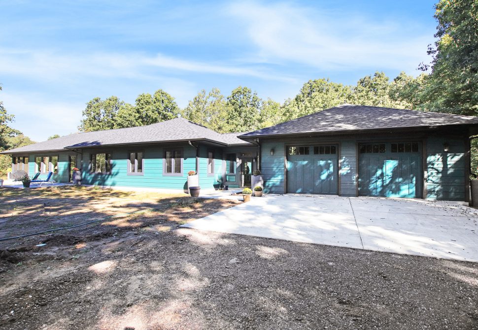 Prickly Pear Sanctuary single-story teal home exterior